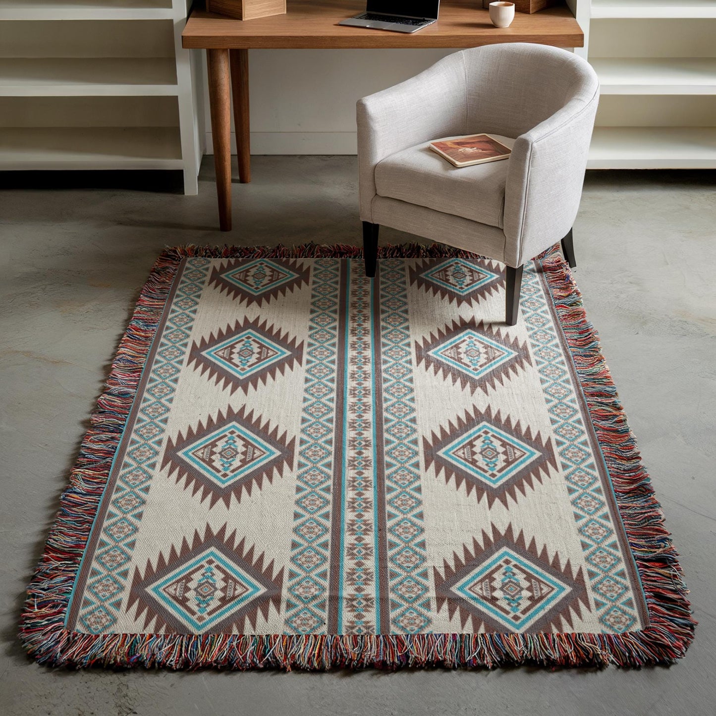 a cozy living space with a patterned rug, a white armchair, and a wooden desk with a laptop on it.