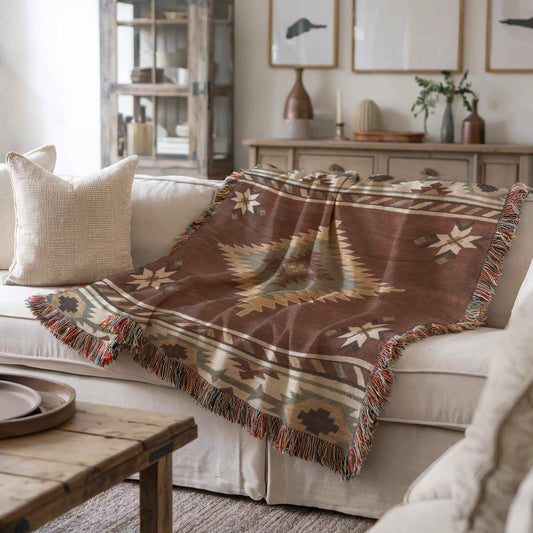 Southwestern woven blanket with geometric pattern styled for layered home decor