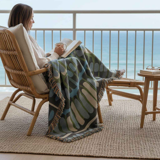 Modern Geometric woven blanket with geometric pattern styled for layered home decor