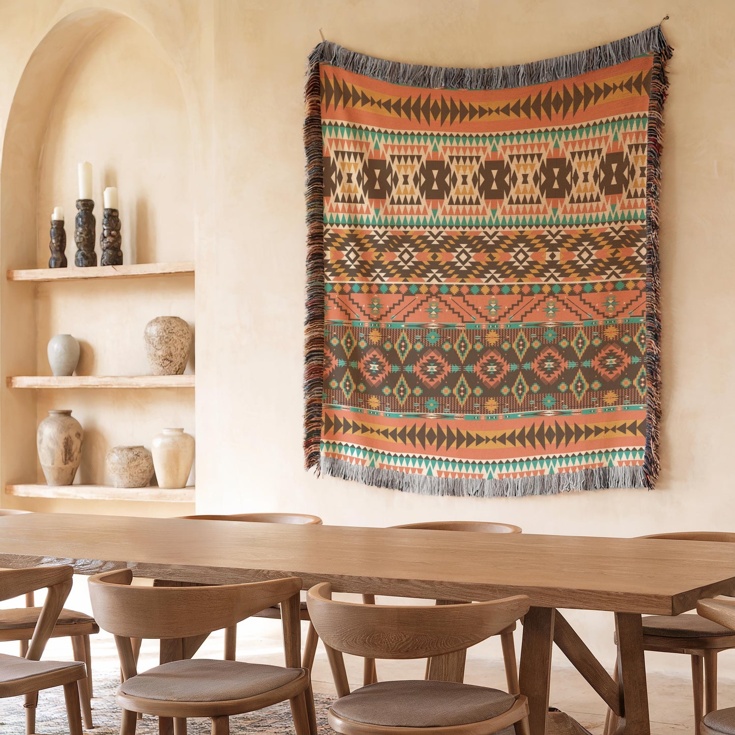 a dining room with a wooden table and chairs, a large colorful rug hanging on the wall, and shelves displaying various decorative items.