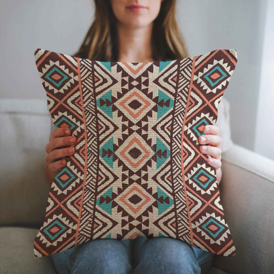 Southwestern pillow cover with geometric pattern styled on a sofa or bed