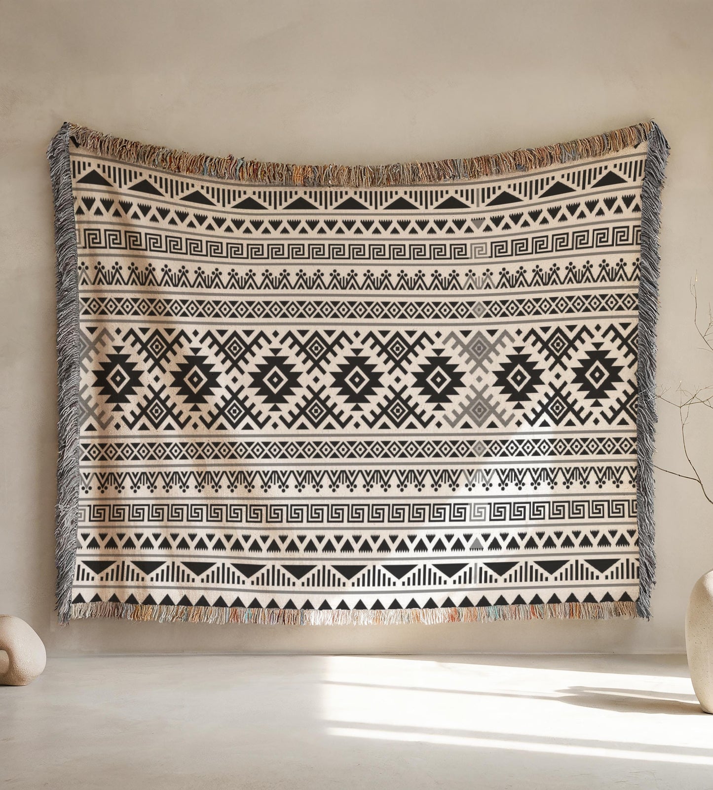 a large, patterned rug hanging on a wall.