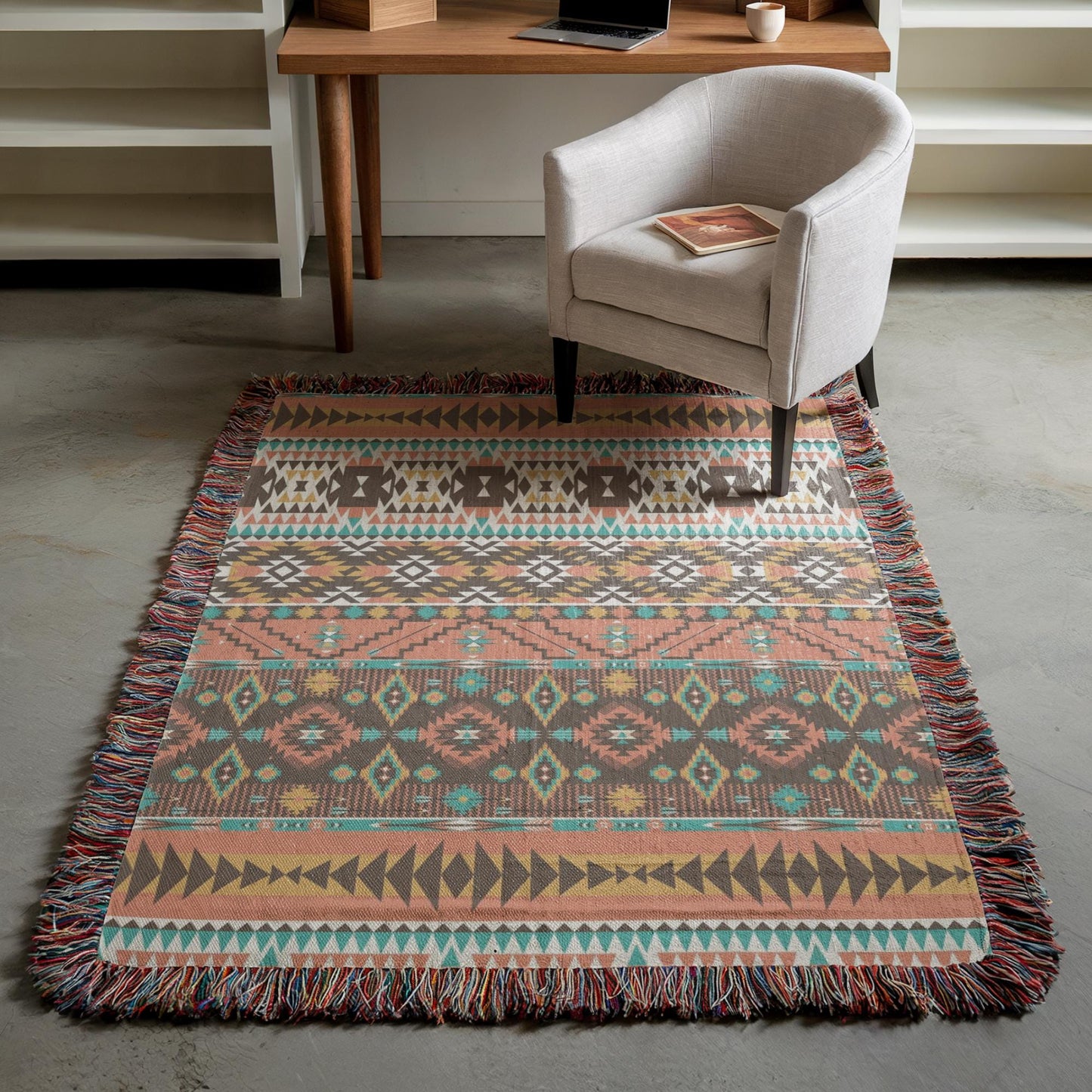 a cozy living room with a patterned rug, a white armchair, and a wooden desk with a laptop on it.