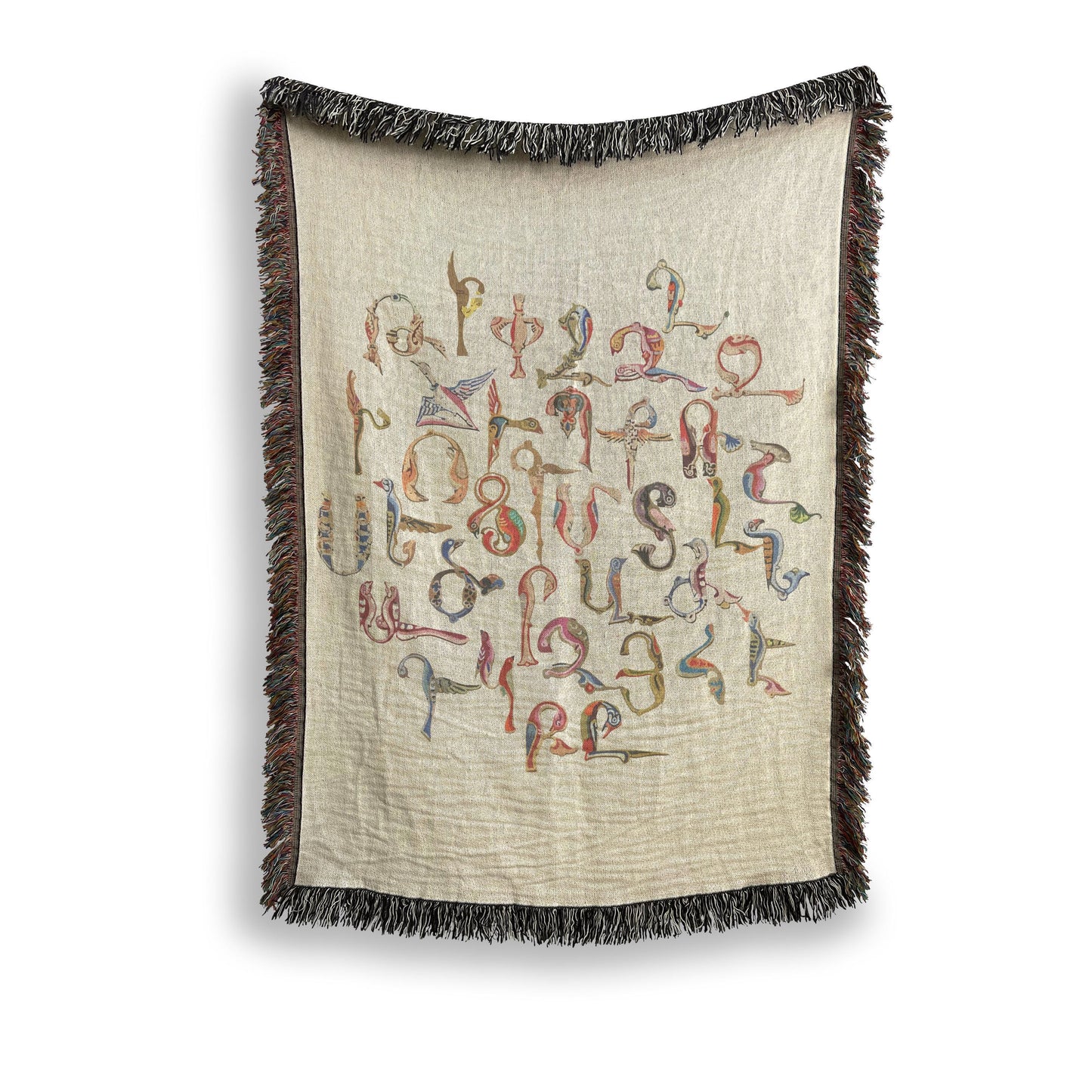 Boho woven blanket with woven pattern styled for layered home decor