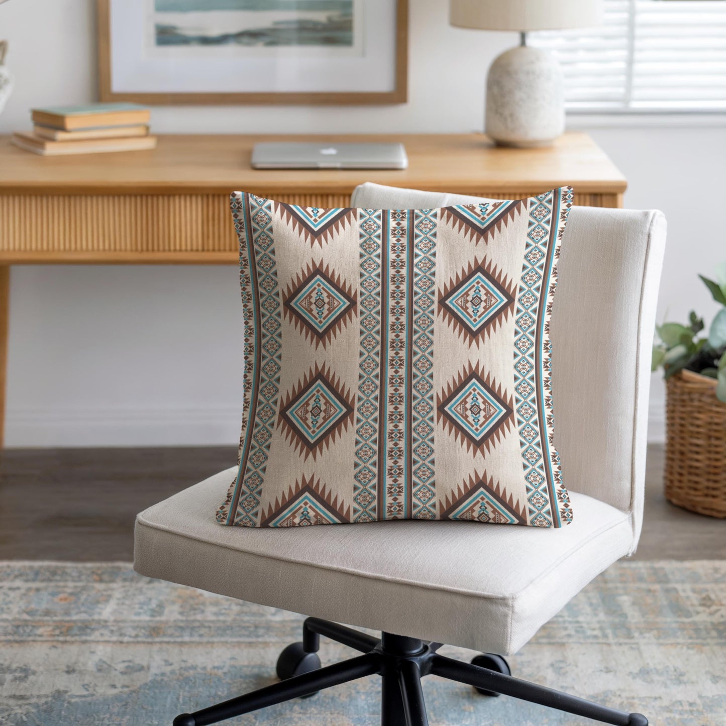 Southwestern throw pillow with geometric pattern styled on a sofa or bed