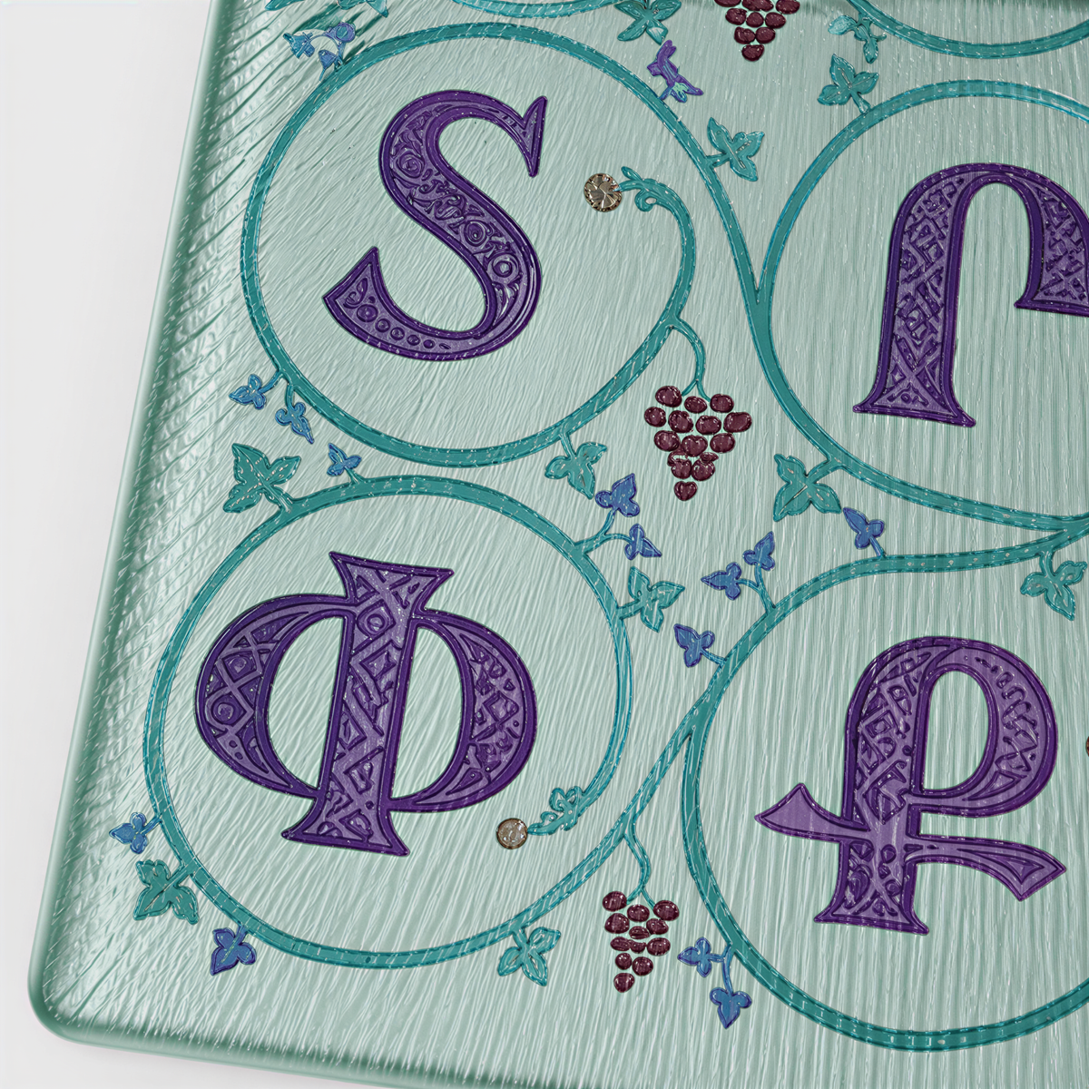Close view of purple Armenian letters in teal circles of leaves with small grape clusters