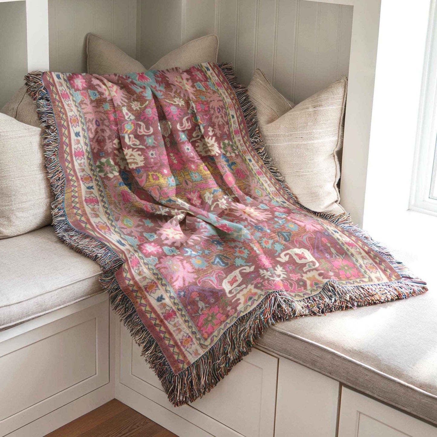 Boho woven blanket with rug-style pattern styled for layered home decor