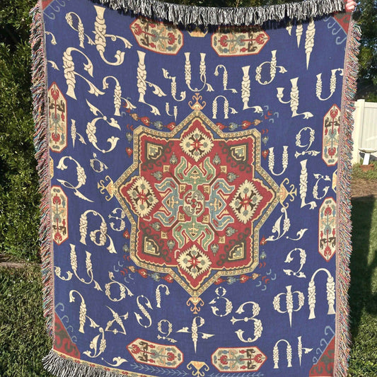 Boho woven blanket with woven pattern styled for layered home decor