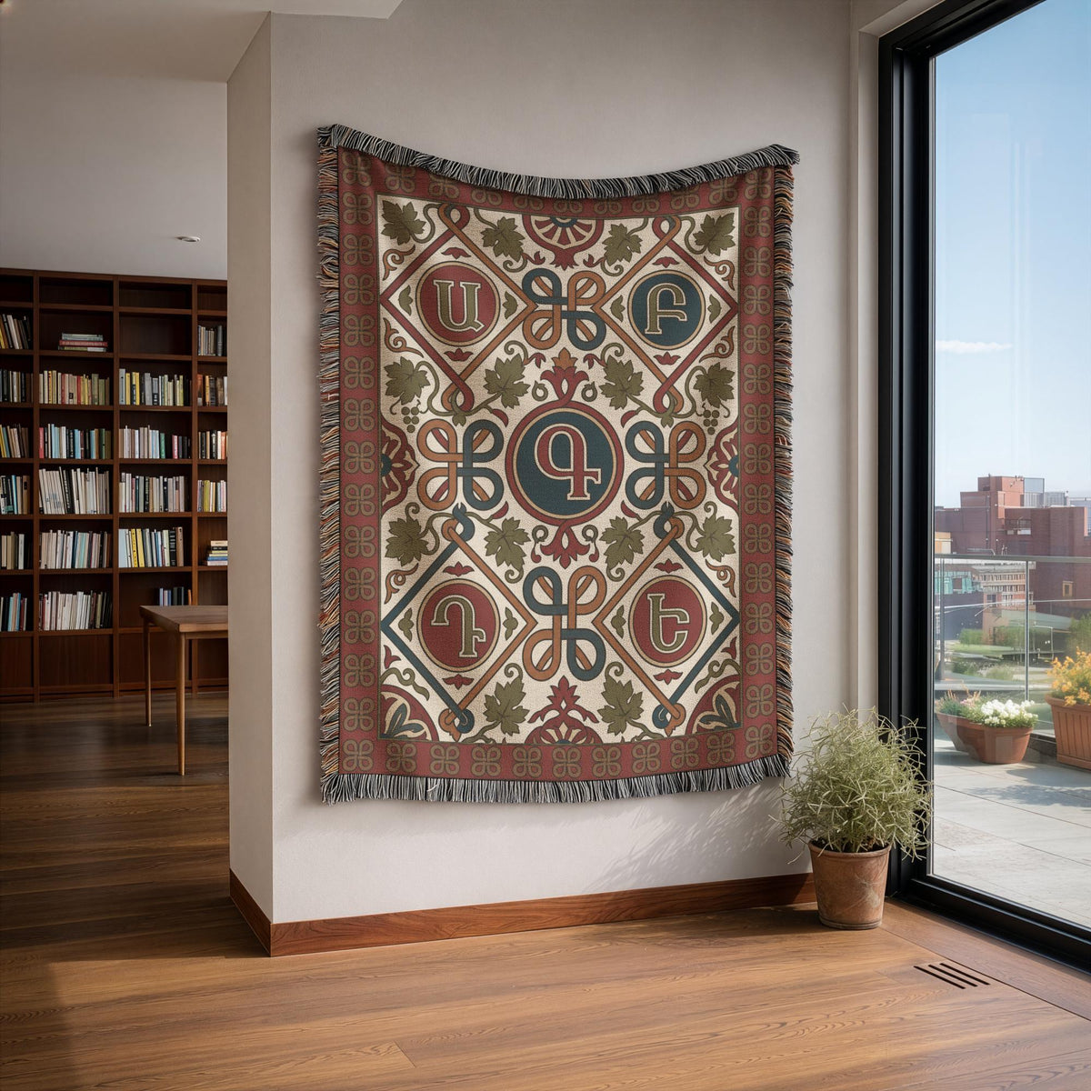 Armenian letter woven wall tapestry in rust and teal displayed on a wall
