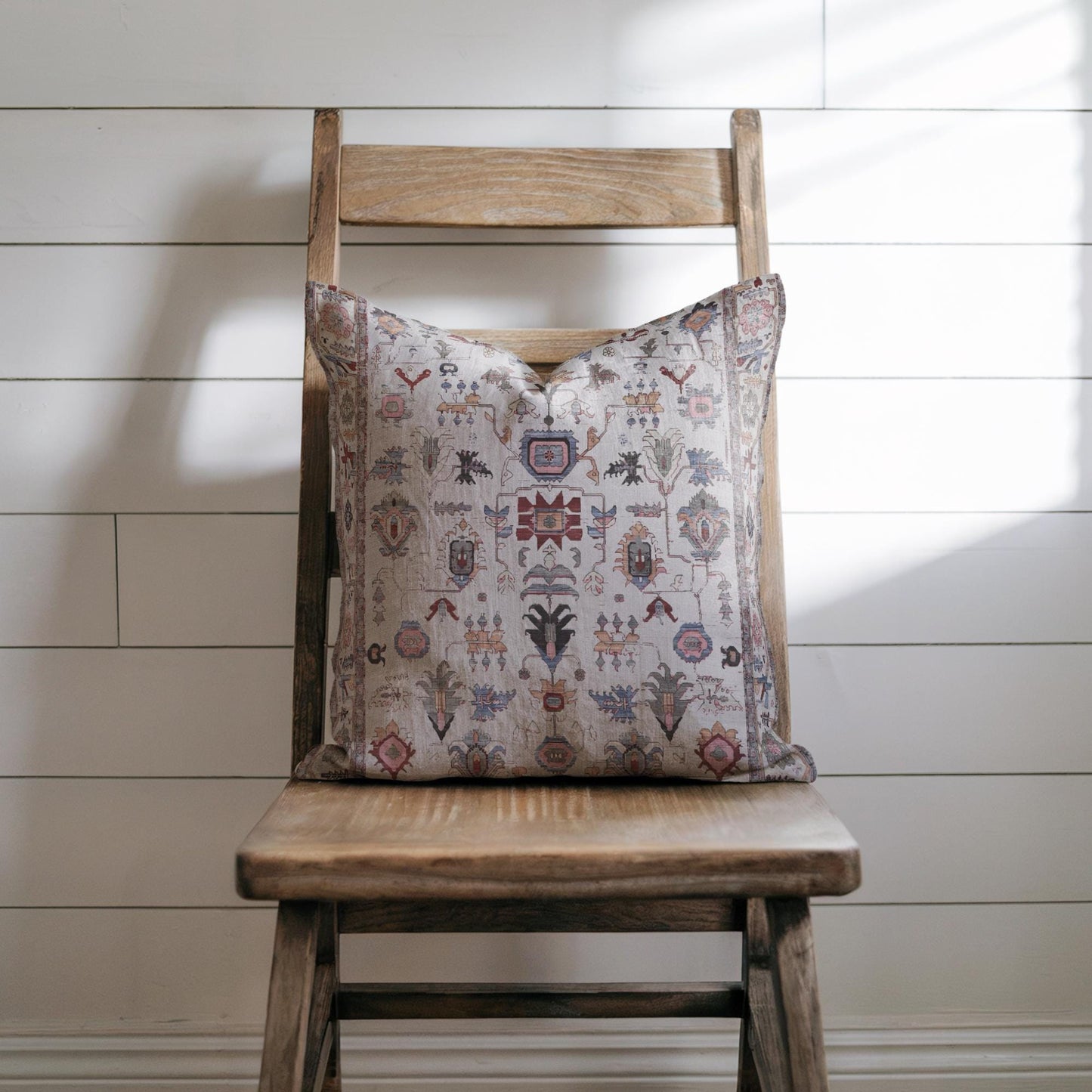 Anatolian Inspired pillow cover with rug-style pattern styled on a sofa or bed