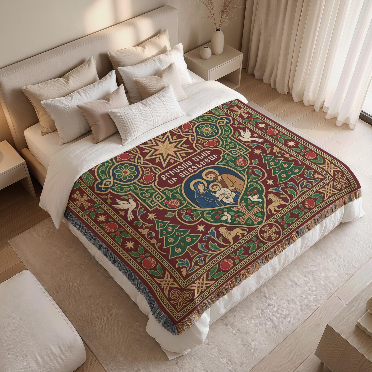 a bedroom with a large bed covered in a colorful, patterned blanket featuring religious imagery. The bed is surrounded by white pillows and a white headboard. The room has a minimalist and modern design, with a white color scheme and a wooden floor.