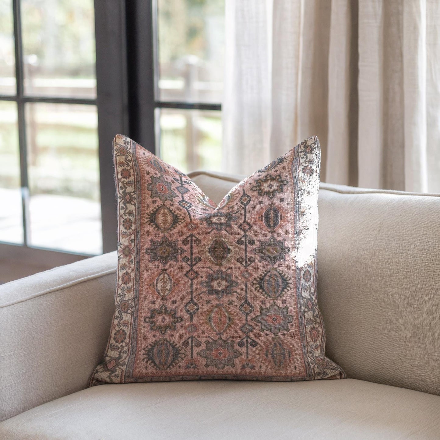 Anatolian Inspired throw pillow with rug-style pattern styled on a sofa or bed