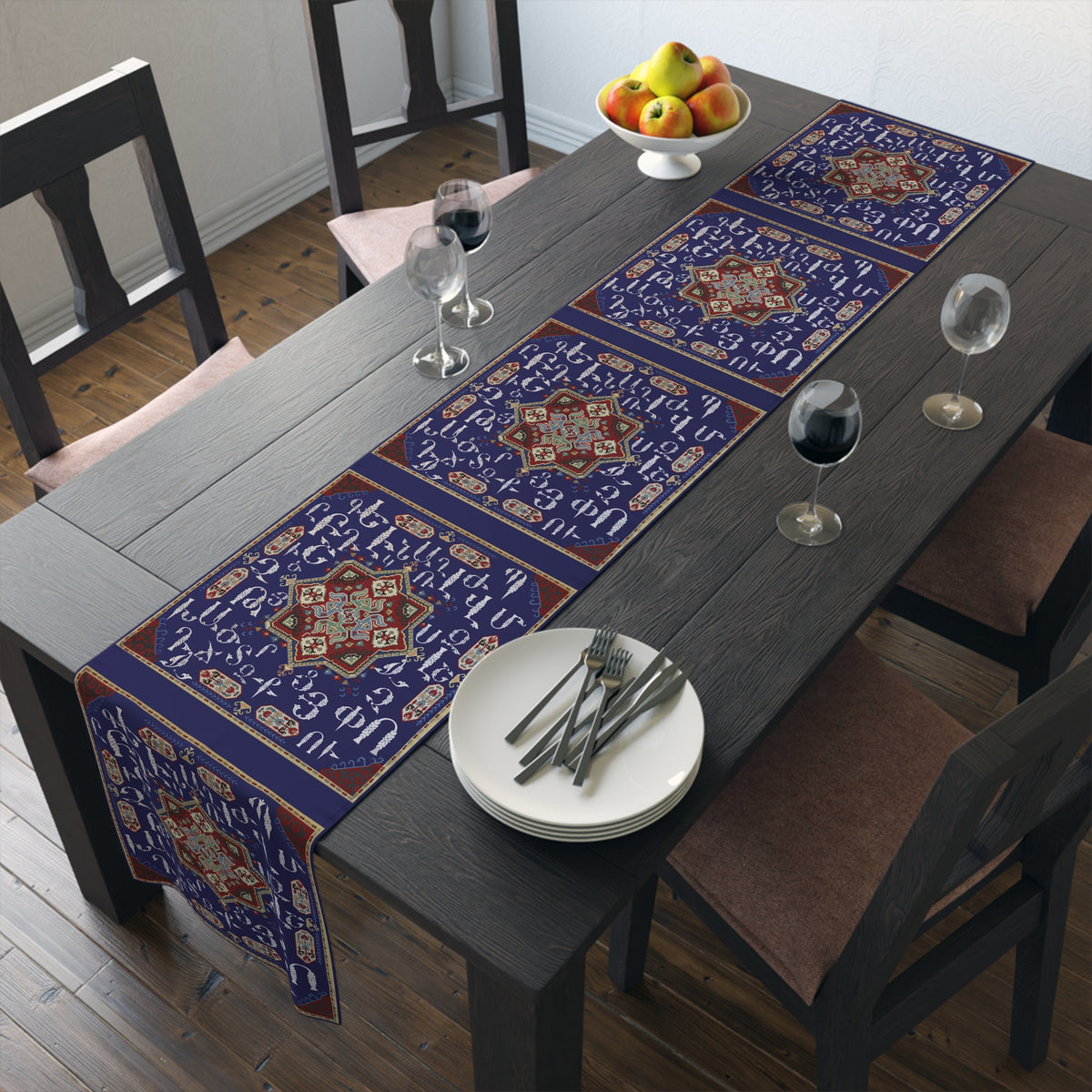 Armenian alphabet table runner in deep blue shown on a dark wood dining table