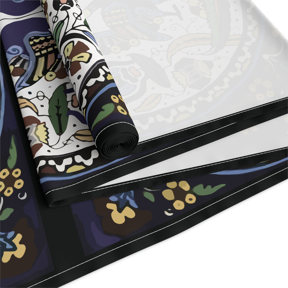 Armenian peacock table runner in dark navy shown on a dark wood dining table
