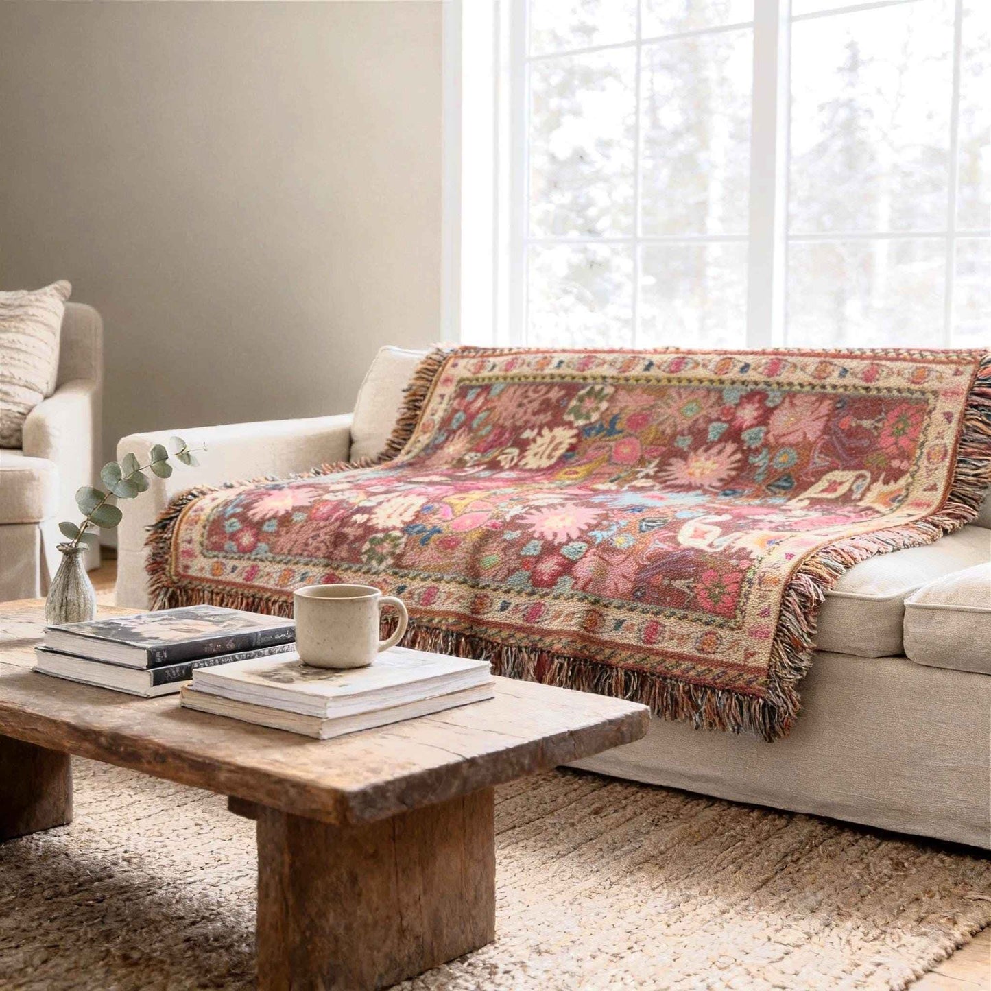 Boho woven blanket with rug-style pattern styled for layered home decor