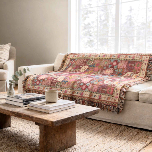 Boho woven blanket with rug-style pattern styled for layered home decor