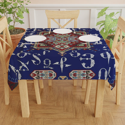 Navy Armenian alphabet square tablecloth on a wooden dining table set with white plates