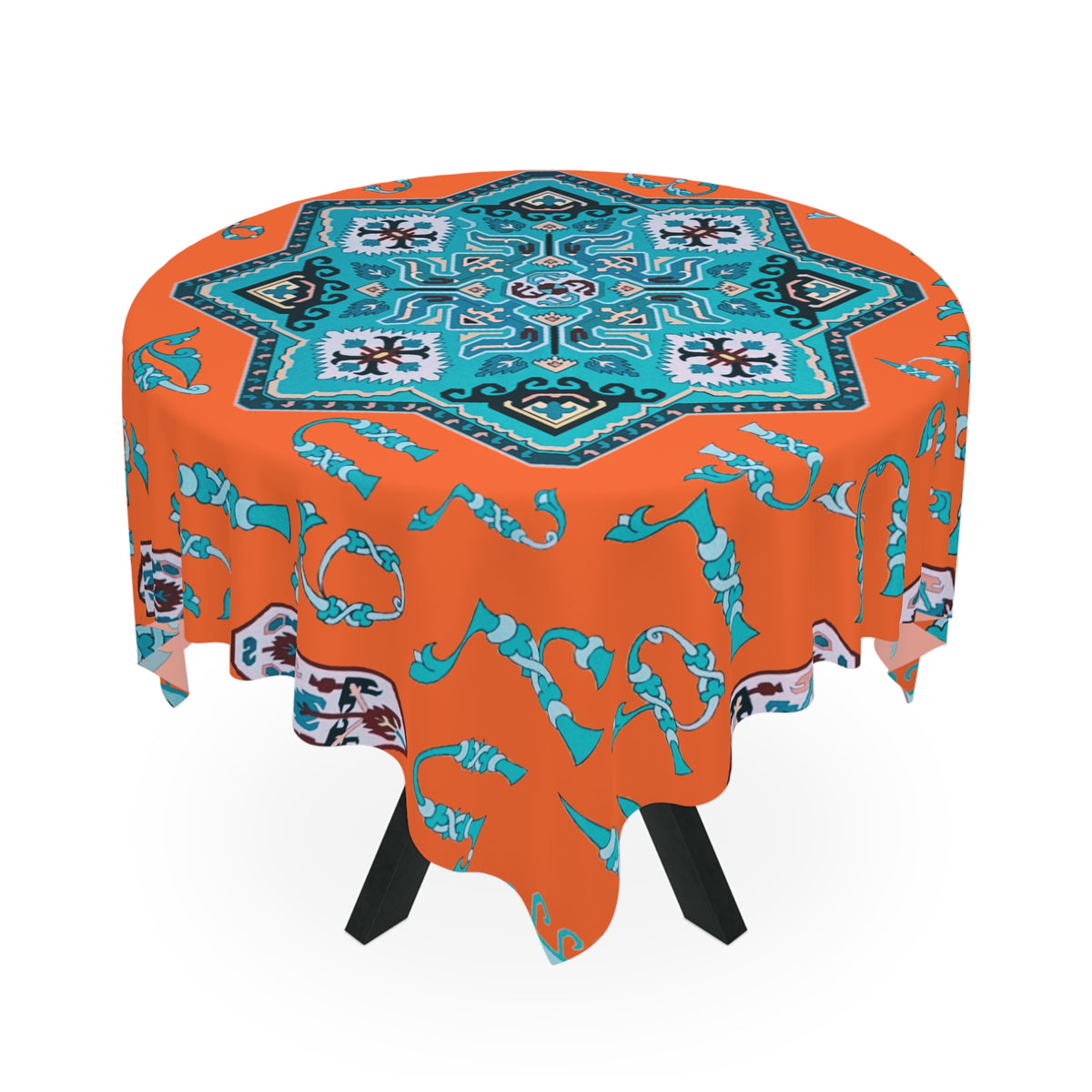 Orange and turquoise Armenian tablecloth draped over a round table beside a window