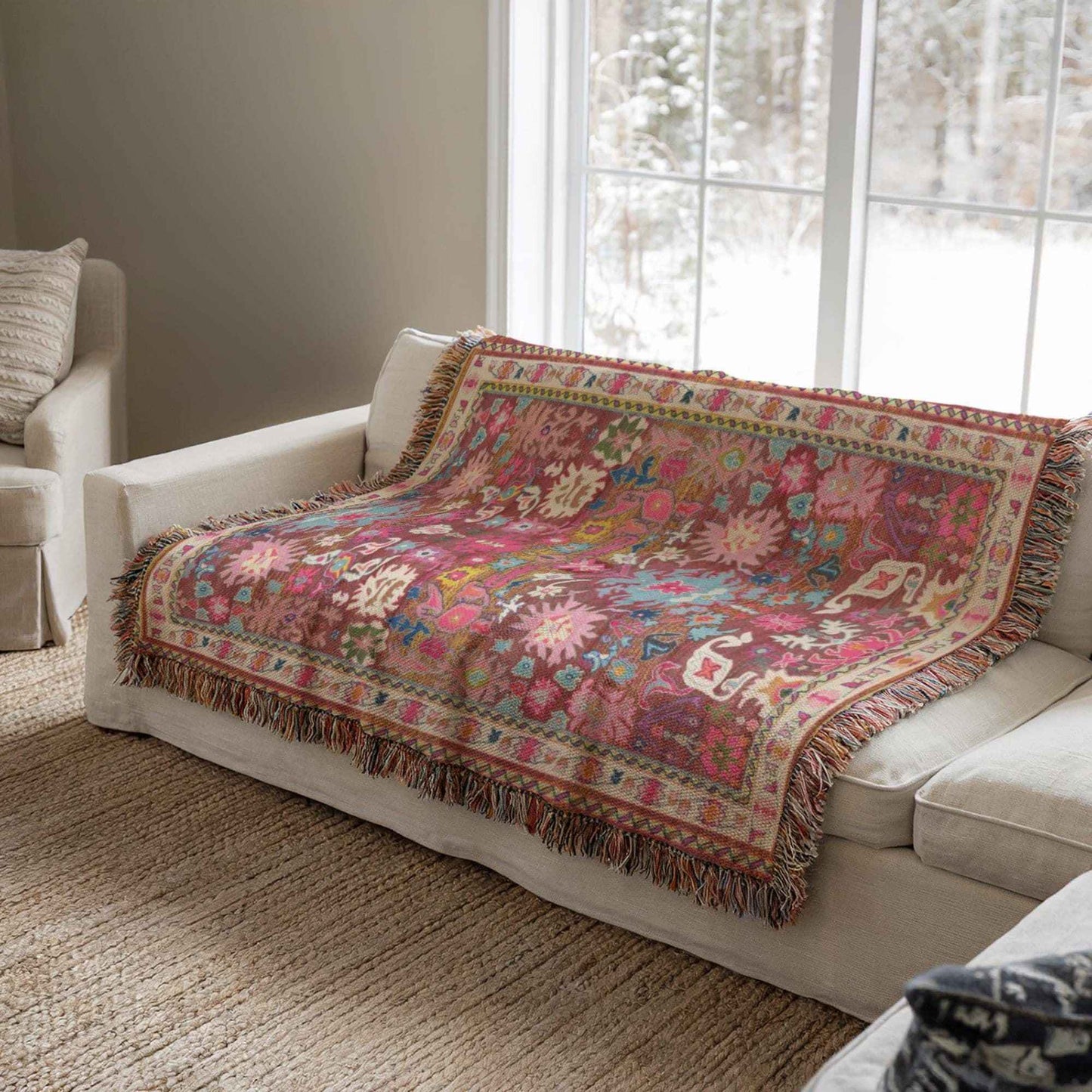 Boho woven blanket with rug-style pattern styled for layered home decor
