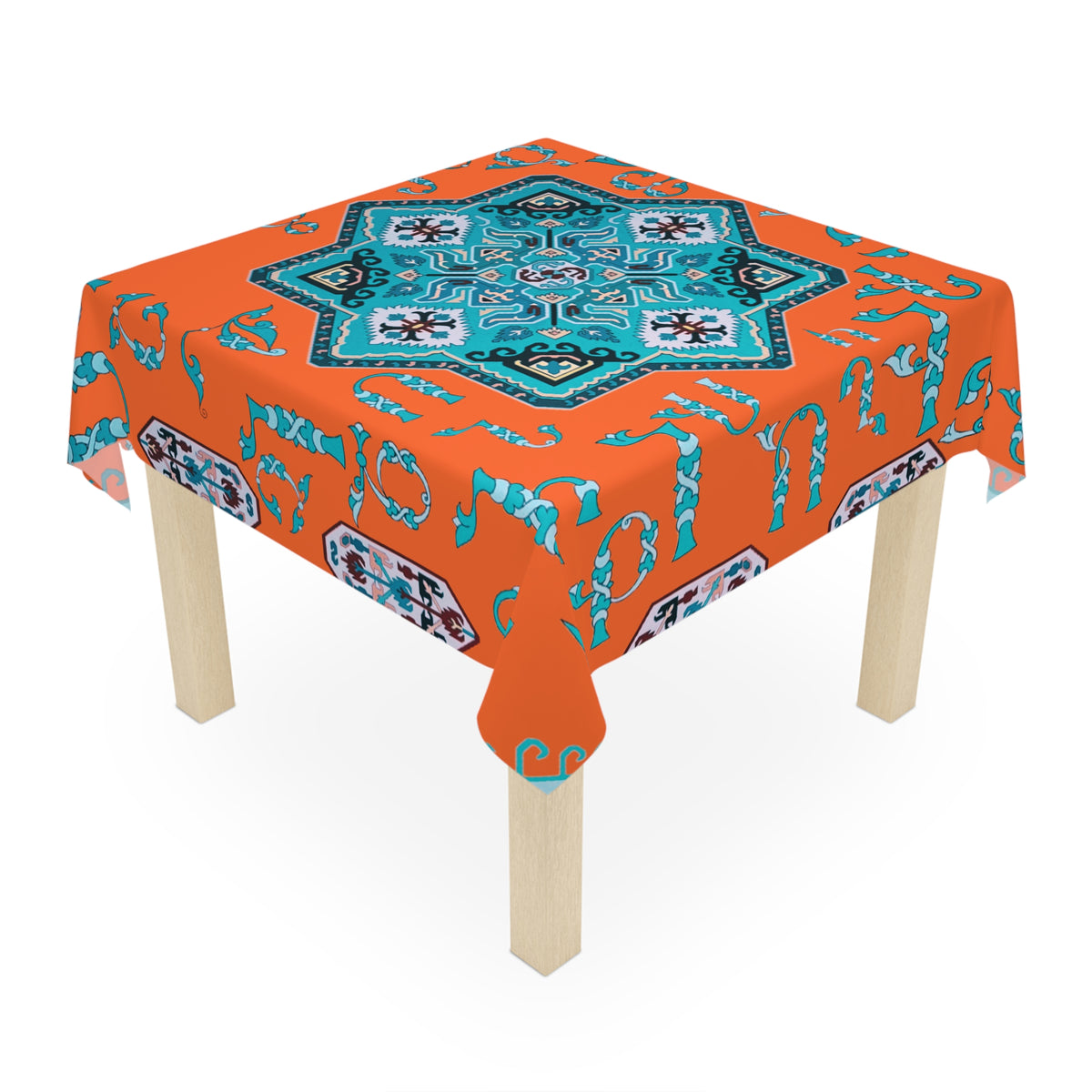 Orange and turquoise Armenian tablecloth on a rectangular table with wooden chairs and house plants