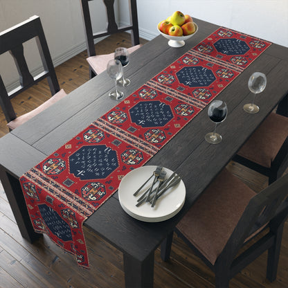 Armenian alphabet table runner in deep red shown on a dark wood dining table