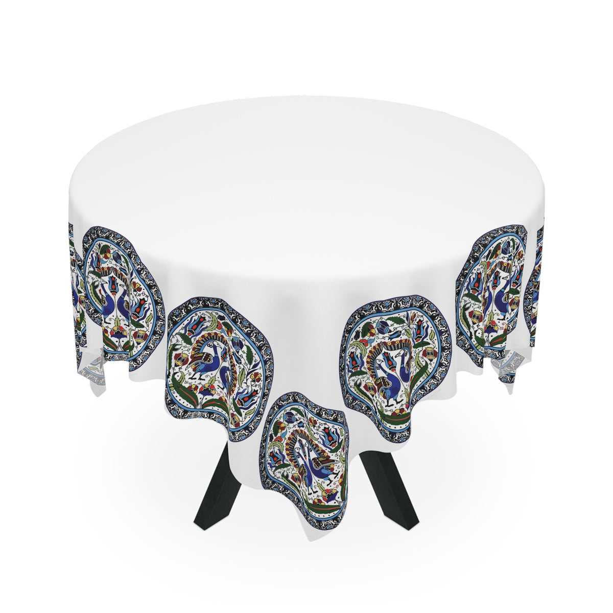 Armenian peacock medallion tablecloth on a rectangular table with wooden chairs and house plants