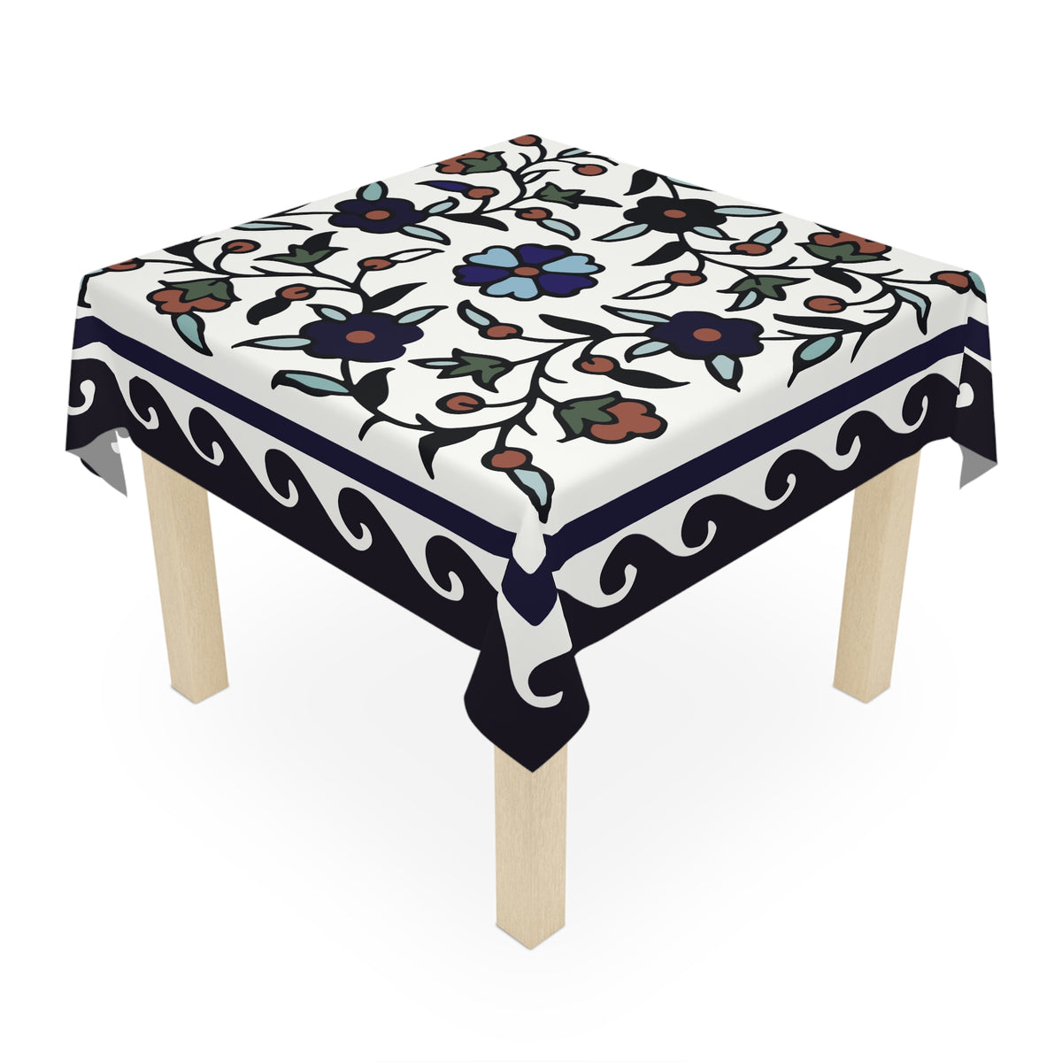 Navy bordered Armenian tablecloth on a rectangular table with wooden chairs and house plants