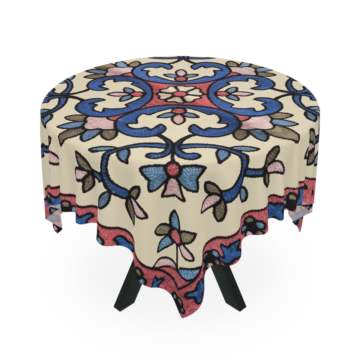 Cream Armenian floral tablecloth on a rectangular table with wooden chairs and house plants