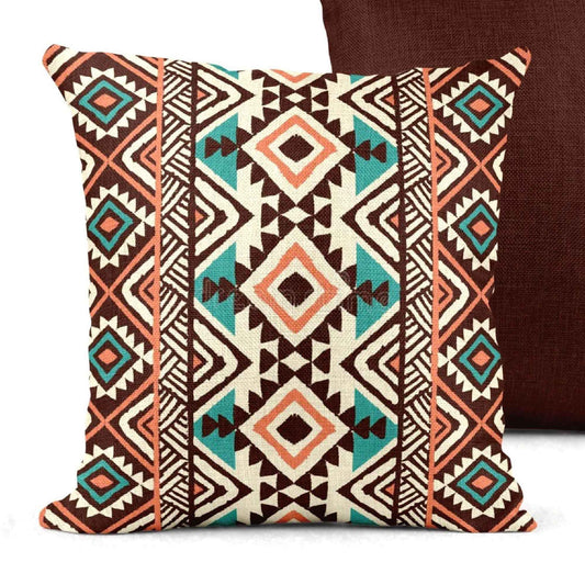 Southwestern pillow cover with geometric pattern styled on a sofa or bed