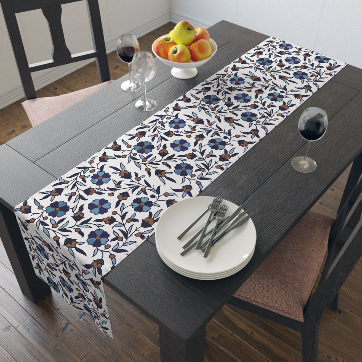 Cream Armenian Iznik poppy table runner on a dining table with wooden chairs and a bowl of fruit