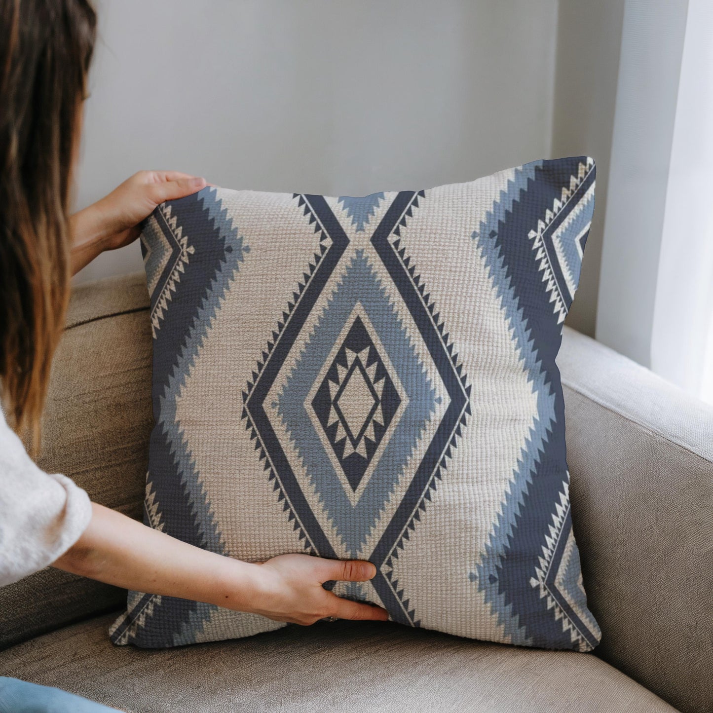 Southwestern pillow cover with geometric pattern styled on a sofa or bed