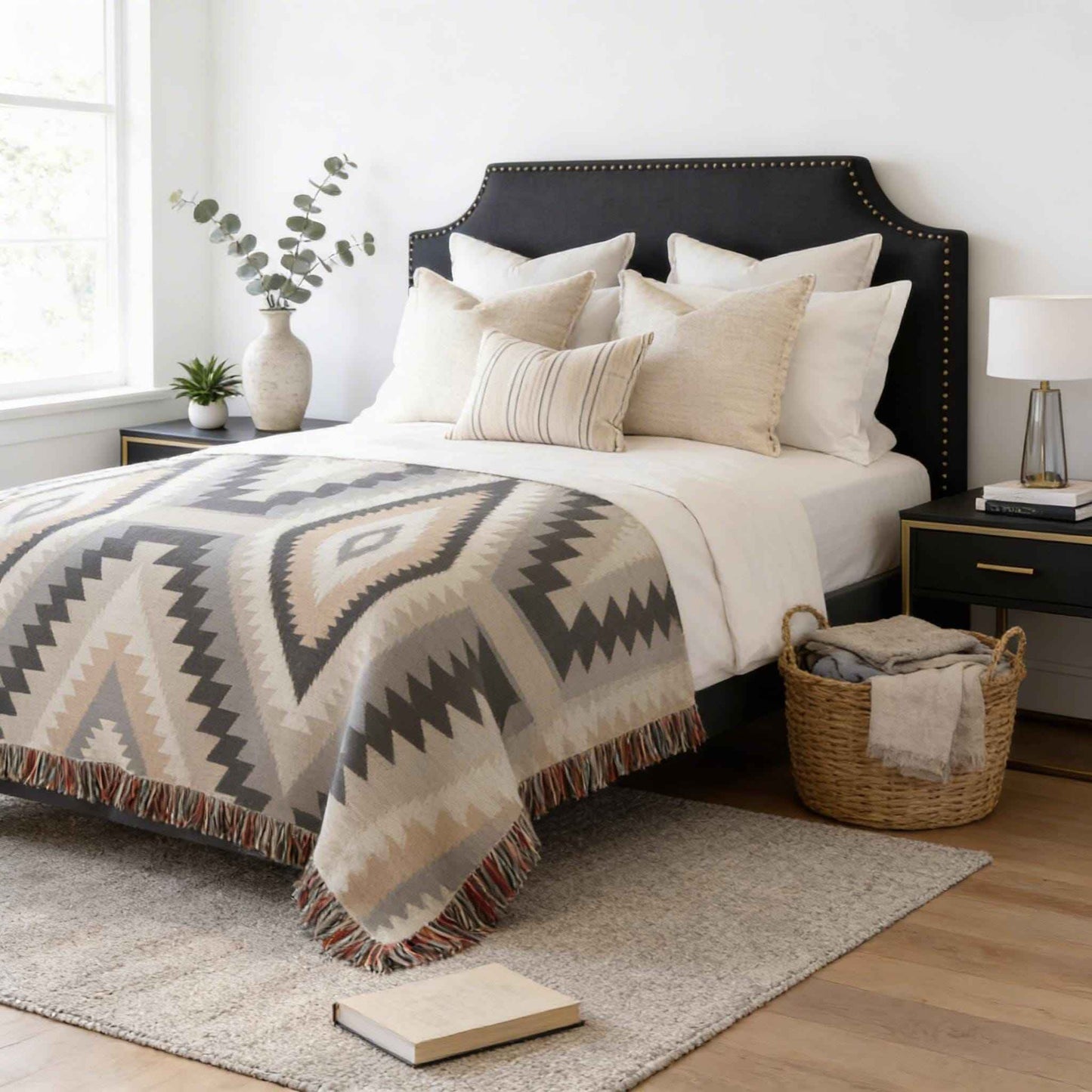 Southwestern woven blanket with geometric pattern styled for layered home decor