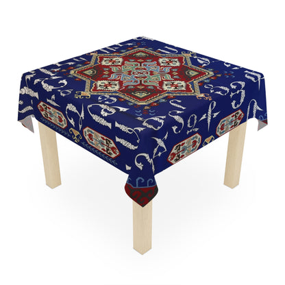 Navy Armenian alphabet tablecloth draped over a square table