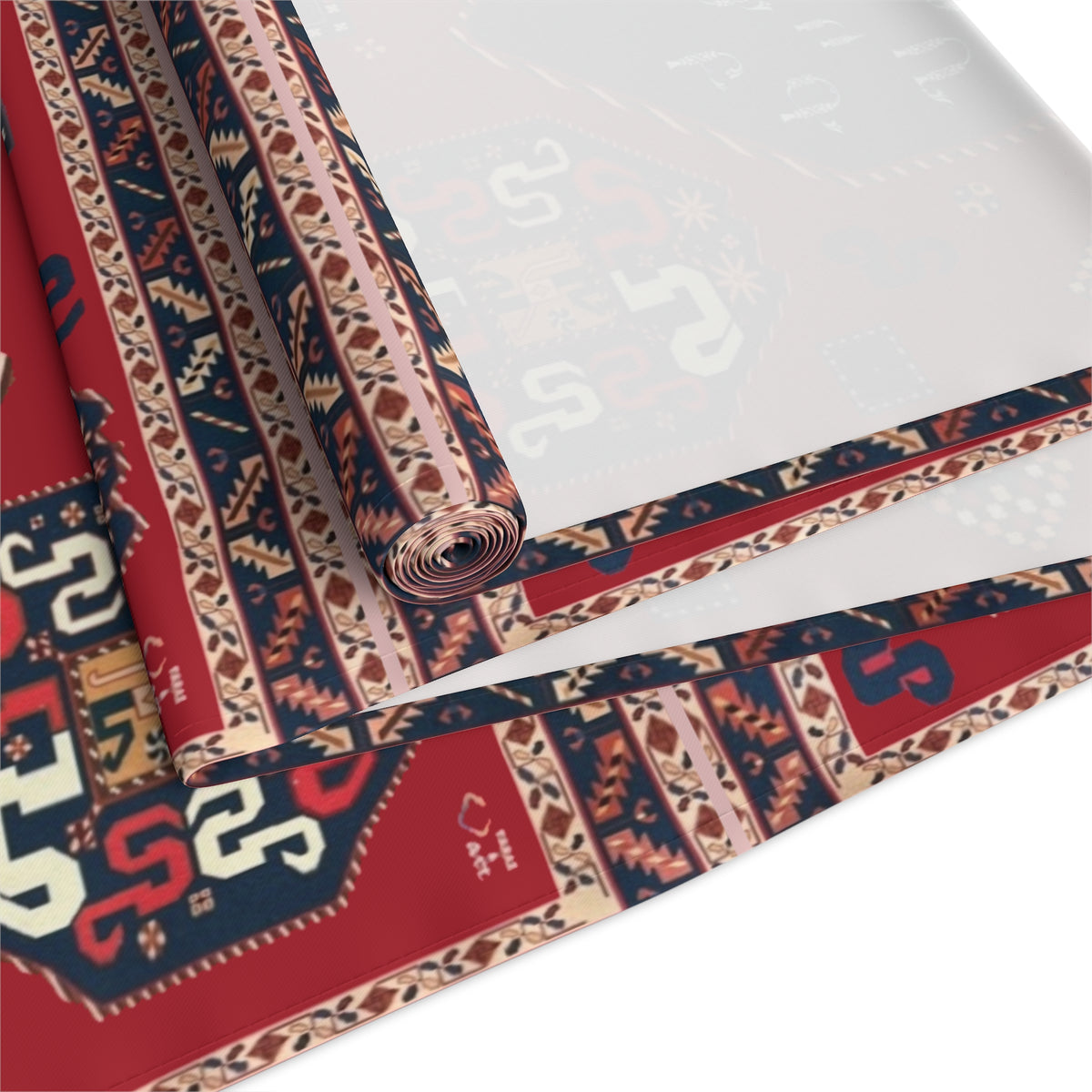Armenian alphabet table runner in deep red shown on a dining table