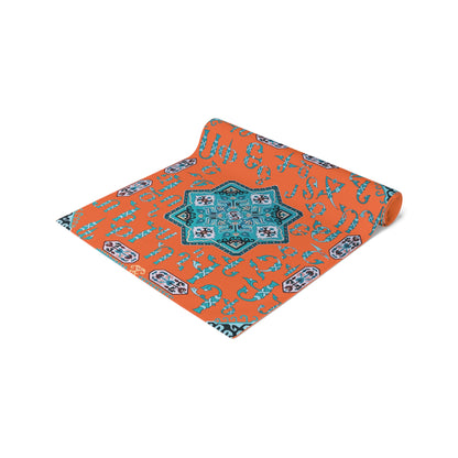 Orange and turquoise Armenian alphabet table runner shown on a dark wood dining table