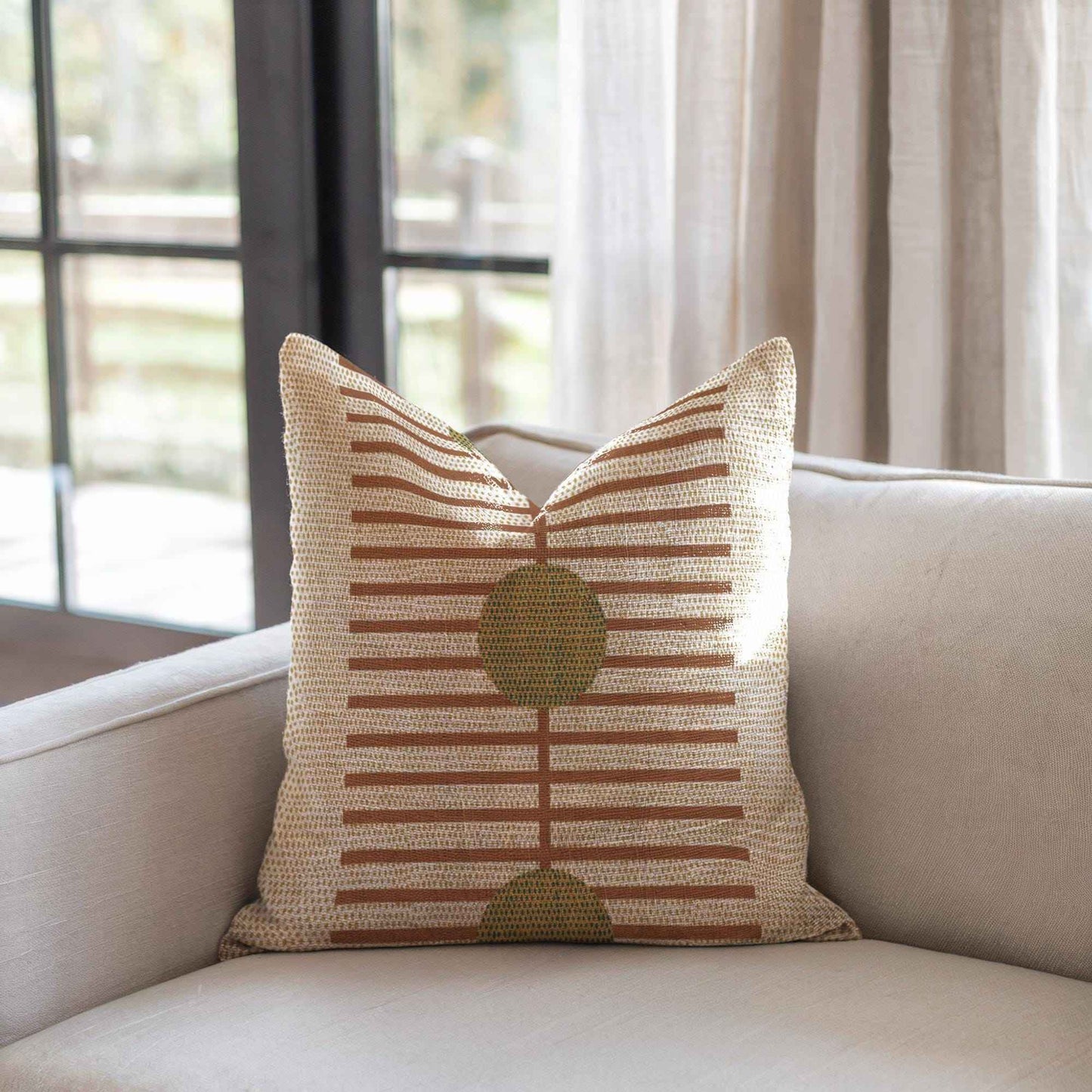 Scandinavian Inspired throw pillow with woven pattern styled on a sofa or bed