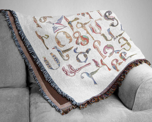 Boho woven blanket with woven pattern styled for layered home decor