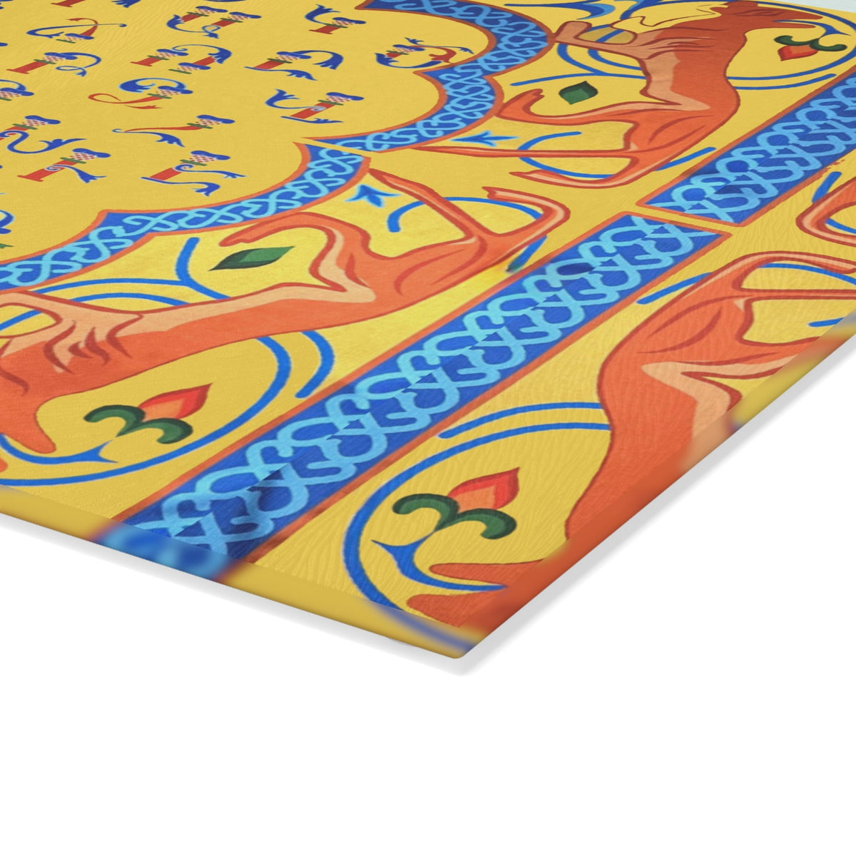 Yellow and blue Armenian alphabet cutting board on a wooden worktop with a knife alongside