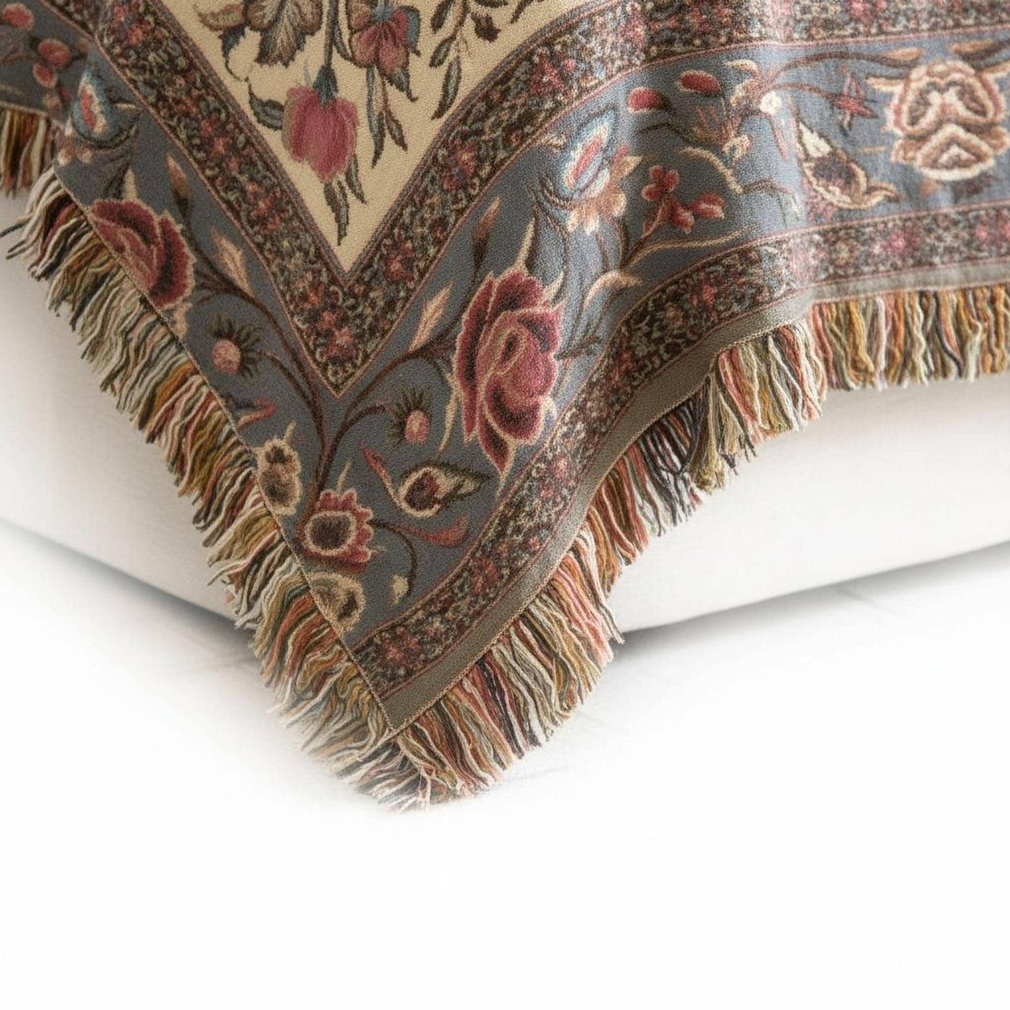 Moroccan Inspired woven blanket with floral pattern styled for layered home decor