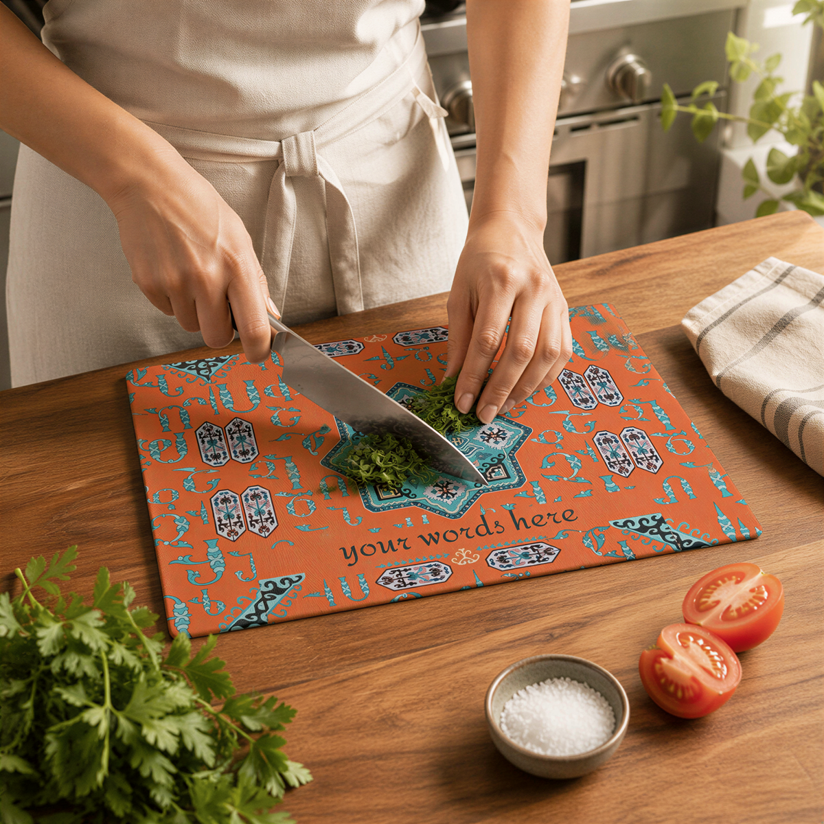 Orange Armenian cutting board in use, a cook chopping herbs at a wood counter