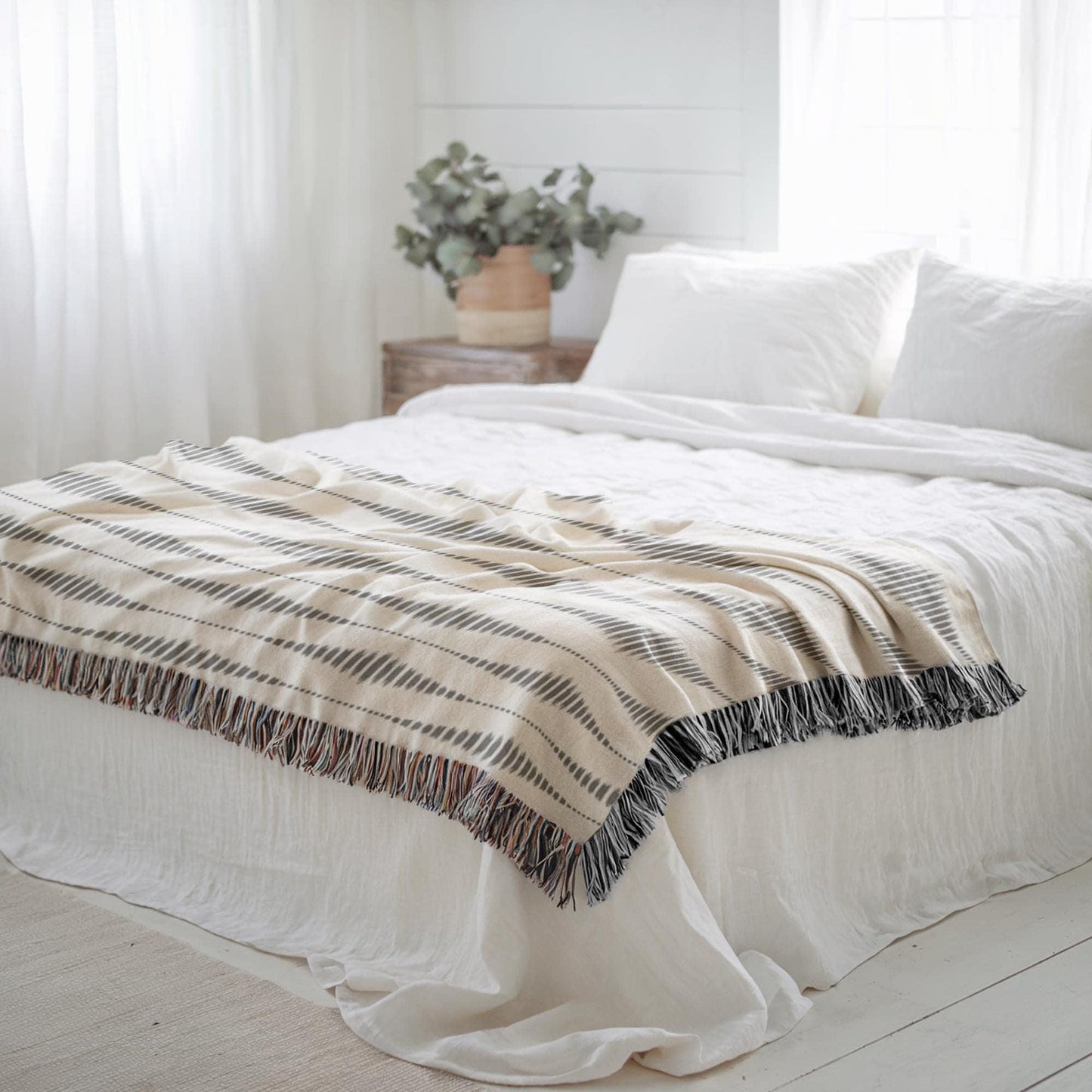 Modern Geometric woven blanket with geometric pattern styled for layered home decor