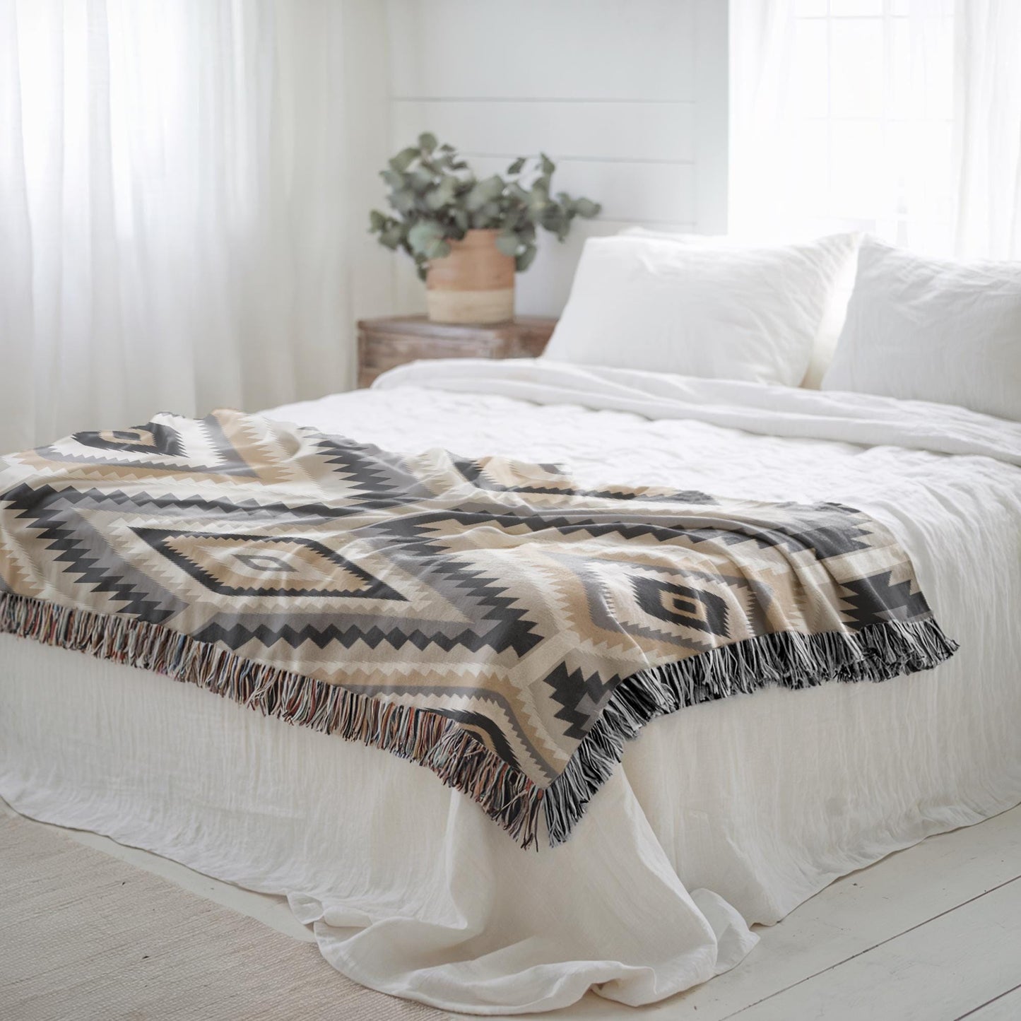Southwestern woven blanket with geometric pattern styled for layered home decor
