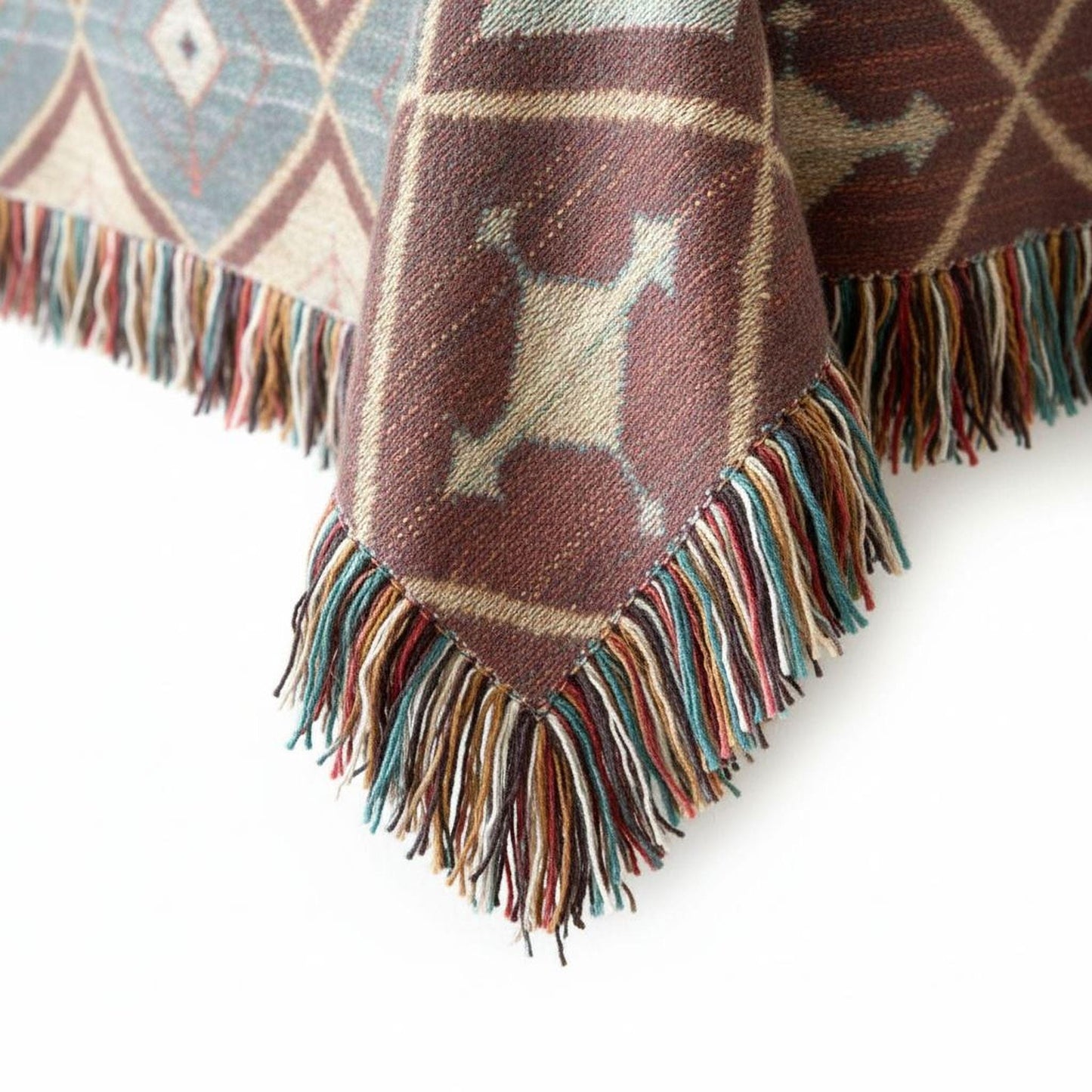 Southwestern woven blanket with geometric pattern styled for layered home decor
