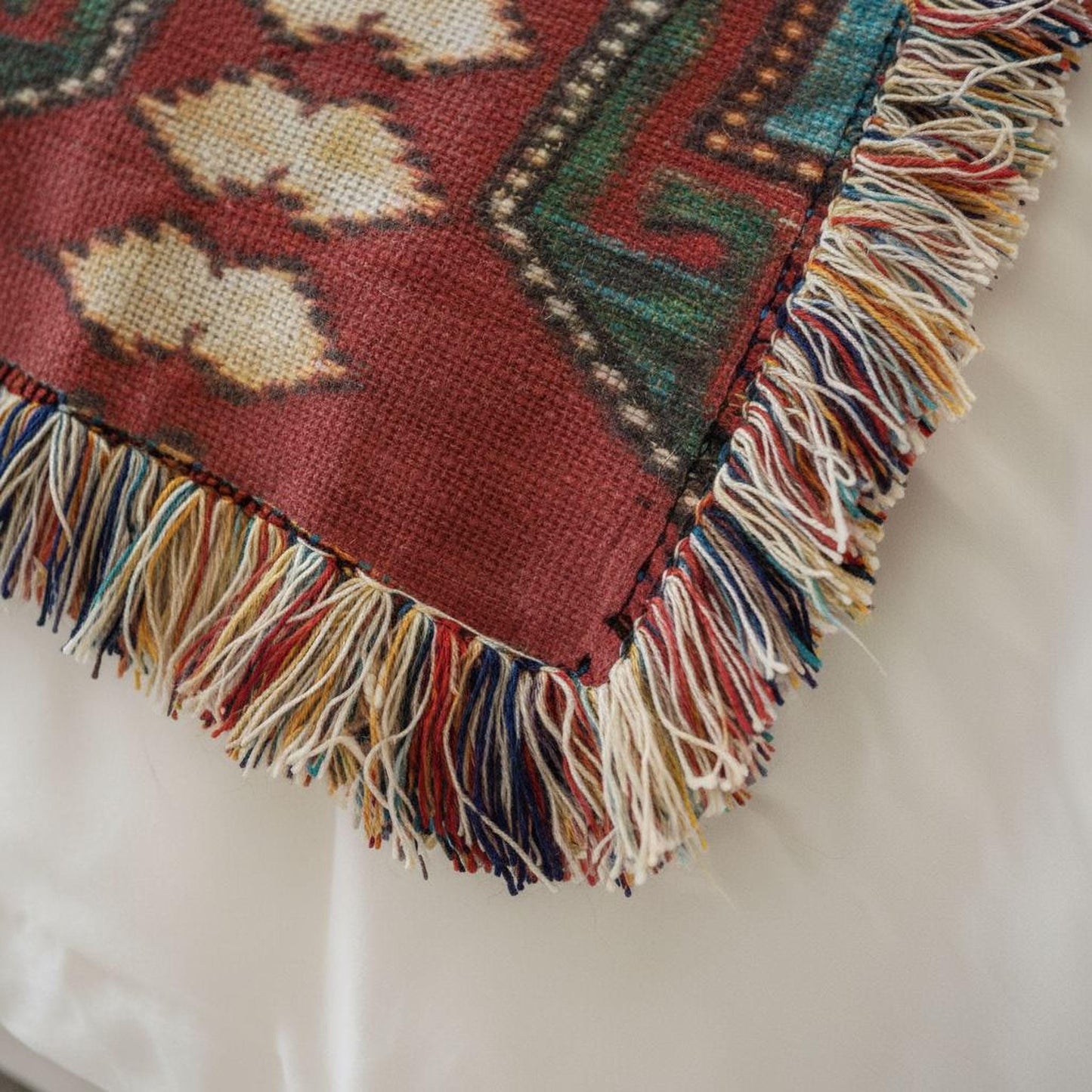 Caucasian Rug Inspired woven blanket with geometric pattern styled for layered home decor