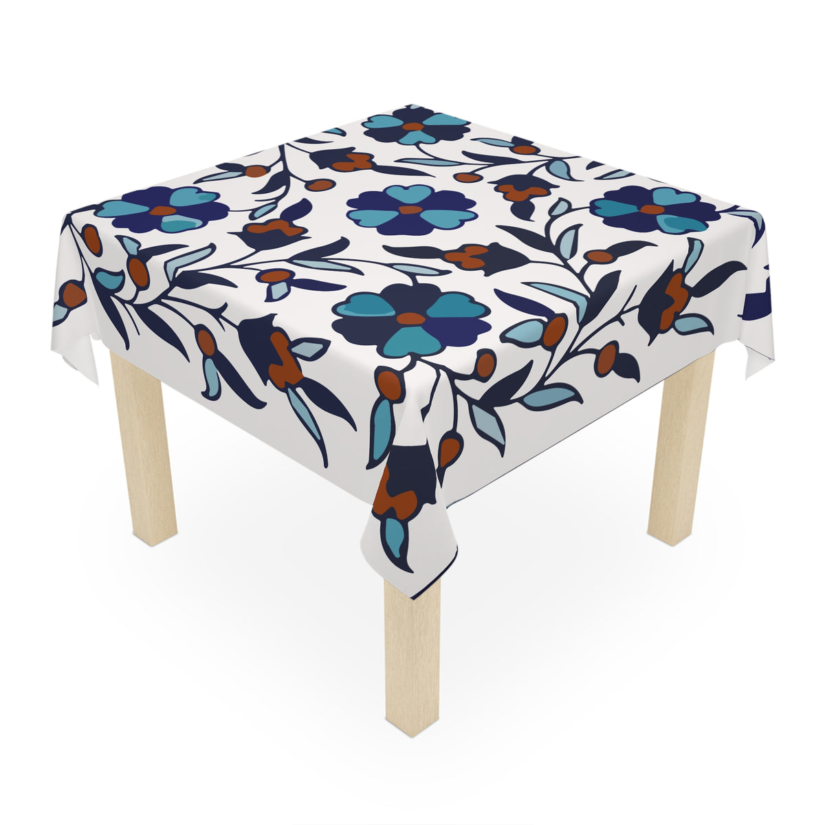 Blue and teal Armenian tablecloth on a round dining table with a vase and a bowl of fruit