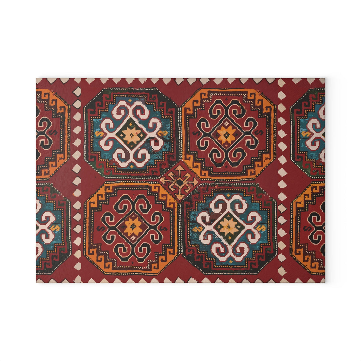 Red and gold Armenian rug motif cutting board on a wooden worktop with a knife alongside
