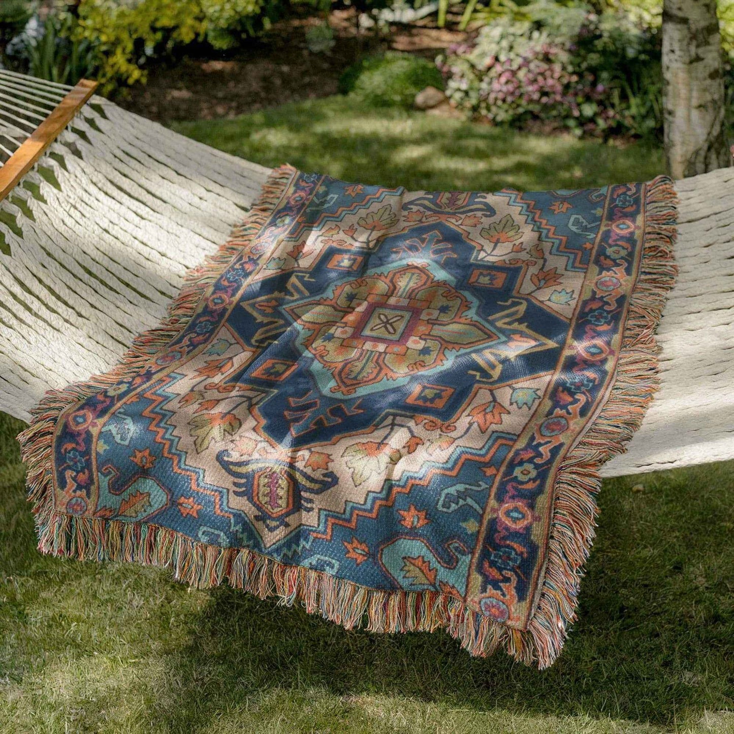 Moroccan Inspired outdoor woven throw blanket with rug-style pattern for patio styling