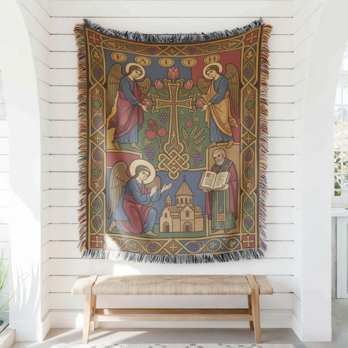 Cross and angels wall tapestry hung on white shiplap above a wooden bench