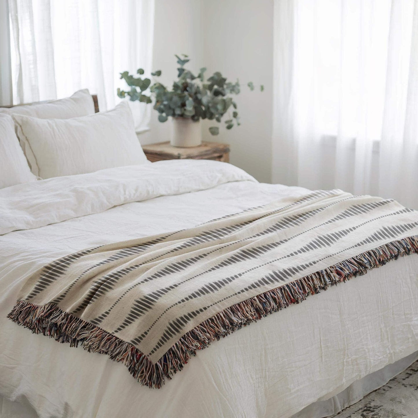 Modern Geometric woven blanket with geometric pattern styled for layered home decor