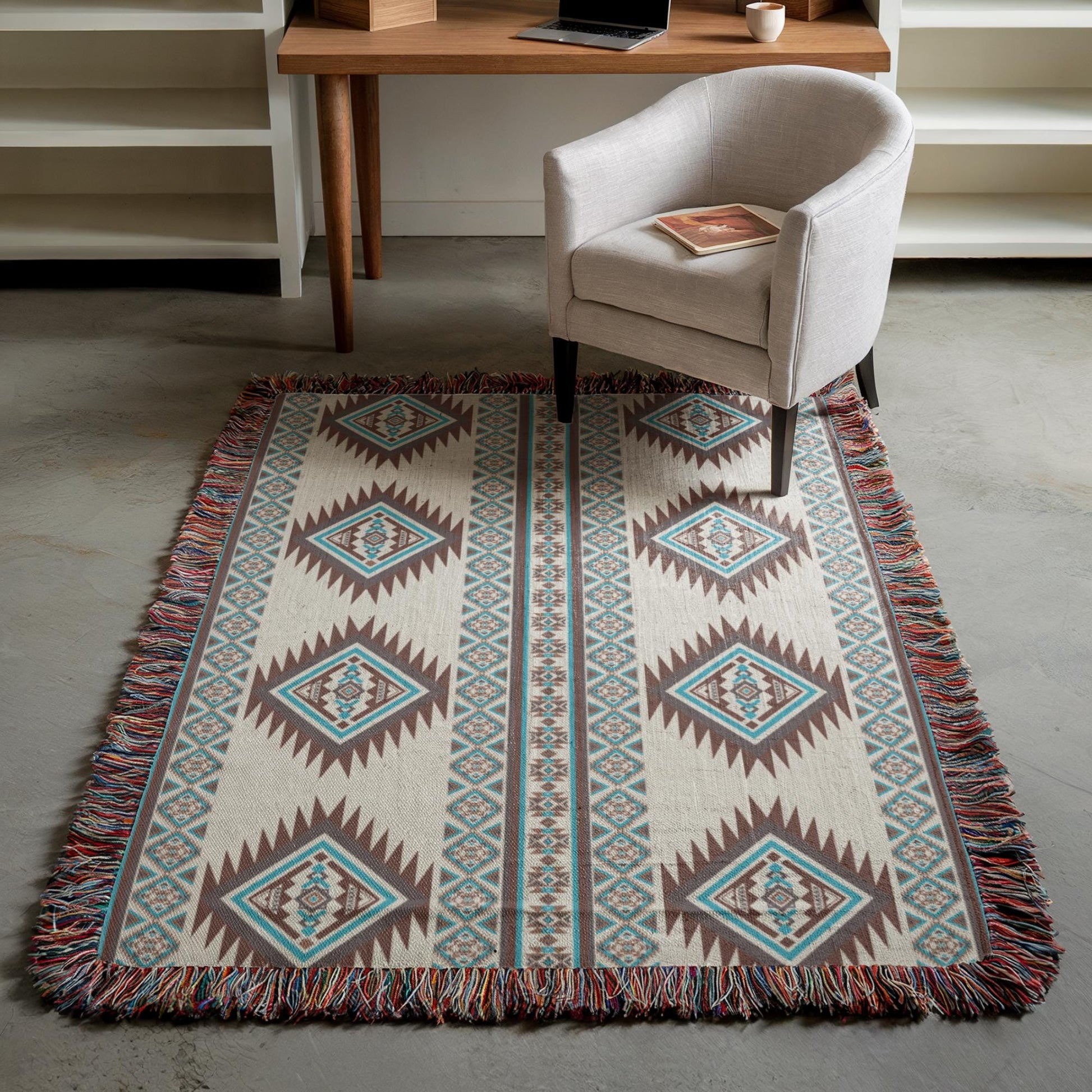 a cozy living space with a patterned rug, a white armchair, and a wooden desk with a laptop on it.